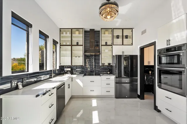 a large kitchen with a sink stove and refrigerator