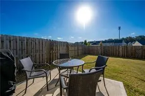 a patio with table and chairs