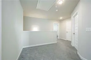 an empty room with a empty space and windows