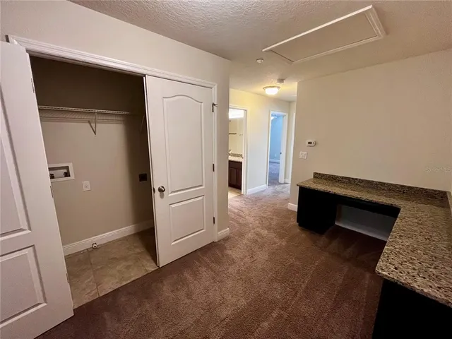 a view of a hallway with staircase