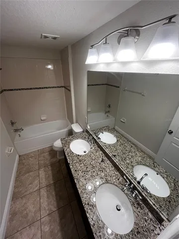 a view of house with backyard