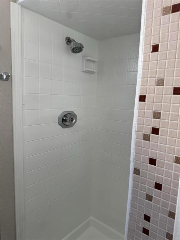 8427 Ridgelea Street Dallas, TX 75209 - Photo 13 of 17 a bathroom with a shower
