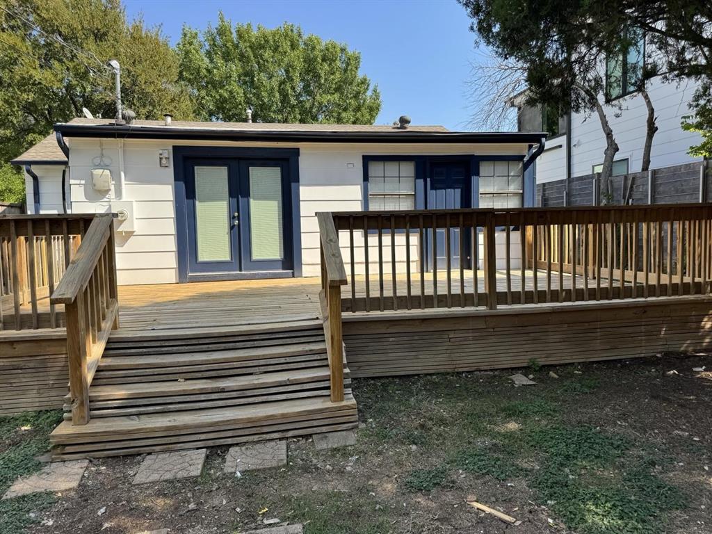 8427 Ridgelea Street Dallas, TX 75209 - Photo 15 of 17 a view of a house with a yard and wooden floor