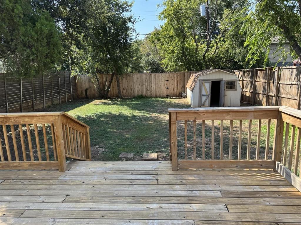 8427 Ridgelea Street Dallas, TX 75209 - Photo 16 of 17 a view of a house with a backyard