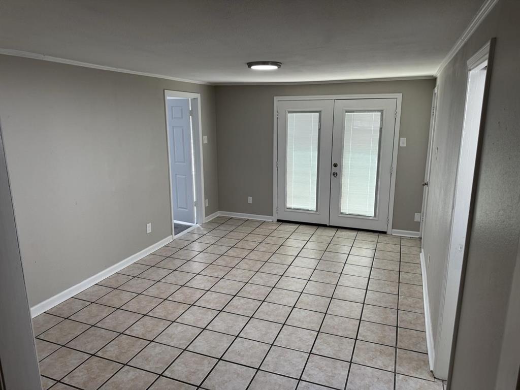 8427 Ridgelea Street Dallas, TX 75209 - Photo 4 of 17 a view of an empty room and window