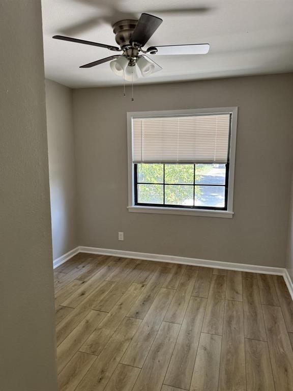 8427 Ridgelea Street Dallas, TX 75209 - Photo 8 of 17 a view of an empty room with a window