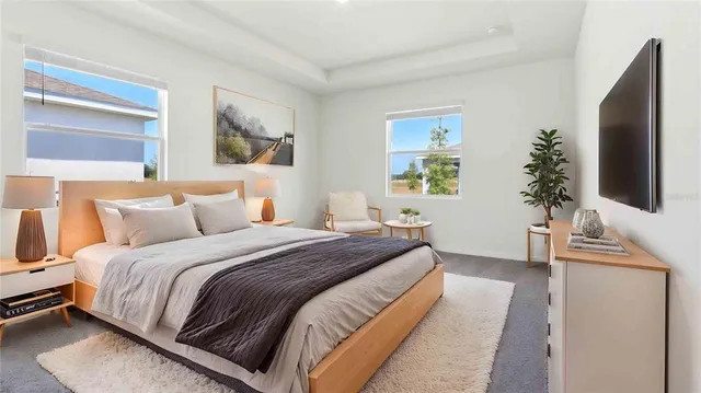 a bedroom with bed and window