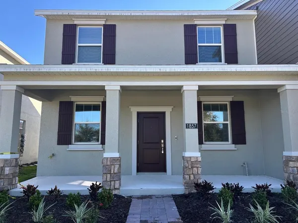 a kitchen with kitchen island stainless steel appliances a refrigerator a stove top oven and a sink