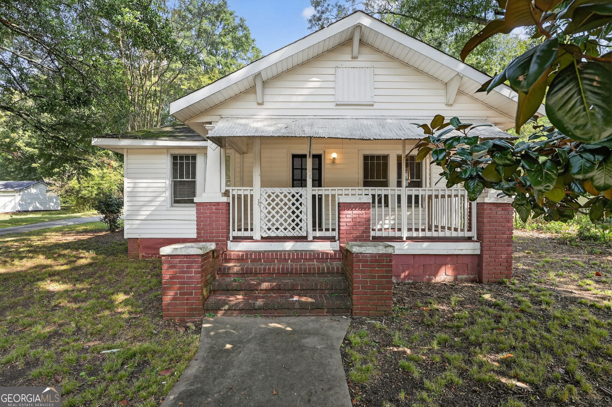 4186 Atlanta Street Powder Springs, GA 30127 - Photo 1 of 1 a front view of a house with a yard