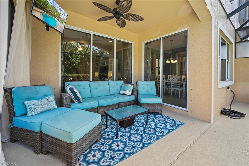 20674 Larino Loop Estero, FL 33928 - Photo 19 of 50 a living room with furniture and a large window