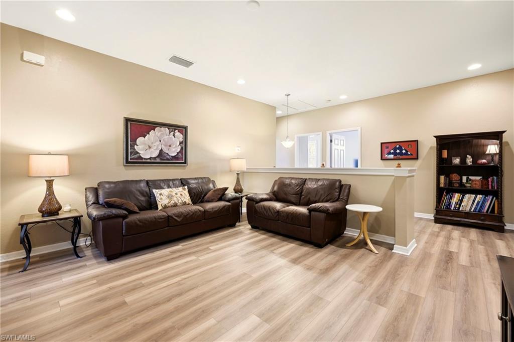 20674 Larino Loop Estero, FL 33928 - Photo 23 of 50 a living room with furniture and a wooden floor