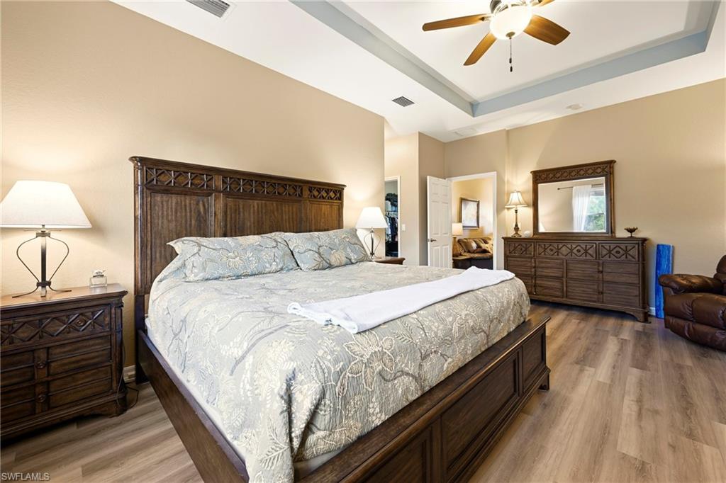 20674 Larino Loop Estero, FL 33928 - Photo 27 of 50 a bedroom with bed and wooden floor