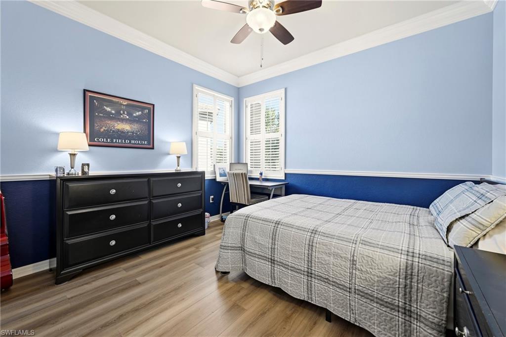 20674 Larino Loop Estero, FL 33928 - Photo 31 of 50 a bedroom with a bed and a window