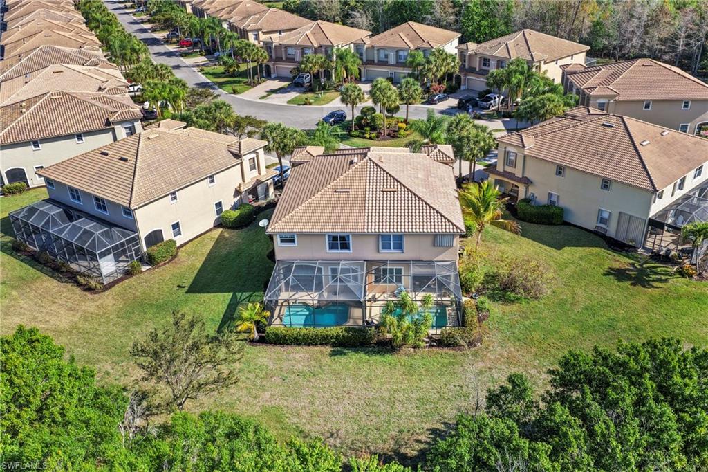 20674 Larino Loop Estero, FL 33928 - Photo 34 of 50 an aerial view of a house with a garden