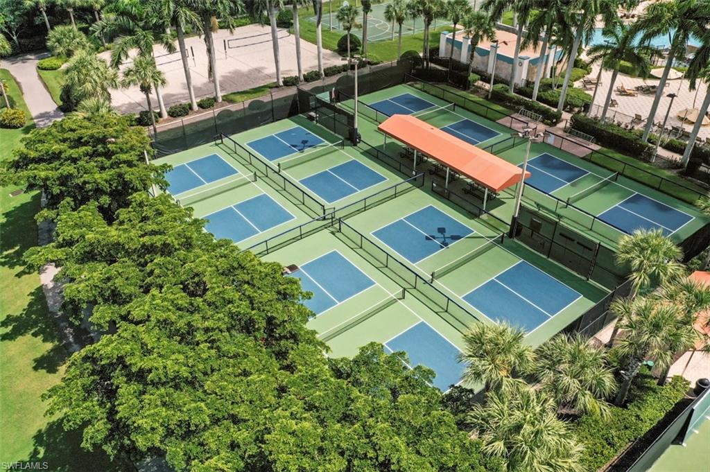 20674 Larino Loop Estero, FL 33928 - Photo 41 of 50 an aerial view of a tennis ground with large trees