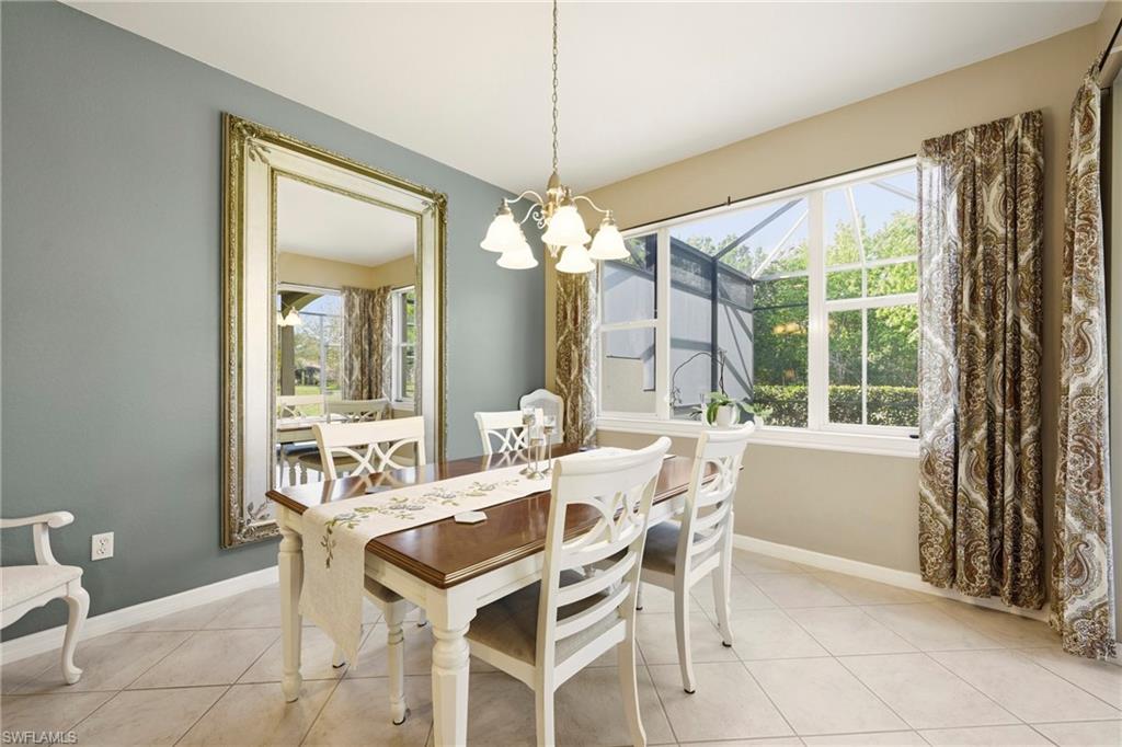20674 Larino Loop Estero, FL 33928 - Photo 10 of 50 a dining room with furniture and window
