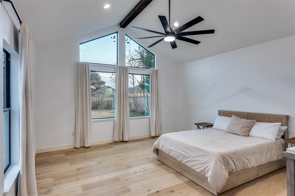 3120 Colcord Avenue Waco, TX 76707 - Photo 12 of 23 a bedroom with a large bed and a large window