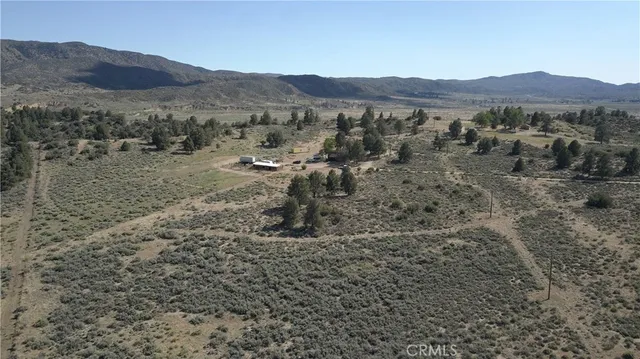 a view of a town with mountains in the background
