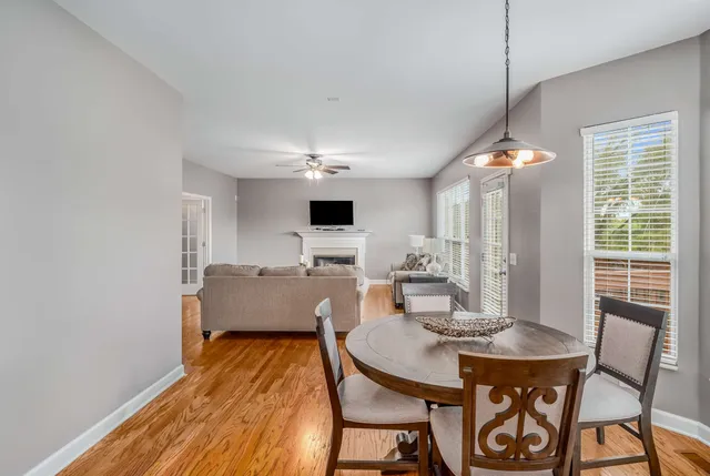 a view of a dining room with furniture and window