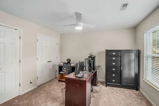 a bathroom with a sink vanity mirror and toilet
