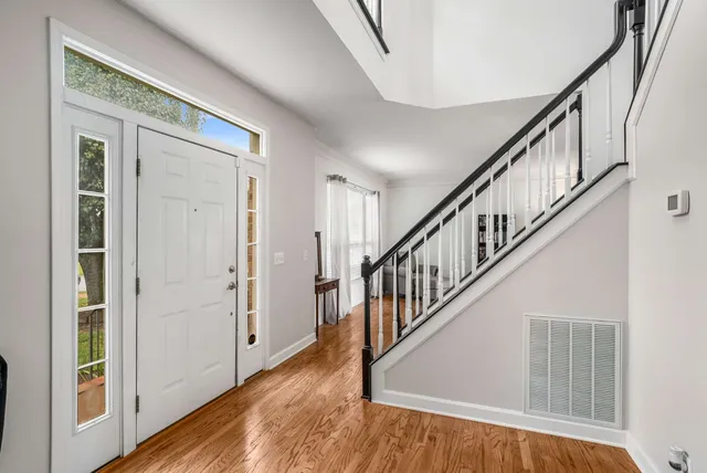 a view of an entryway with wooden floor