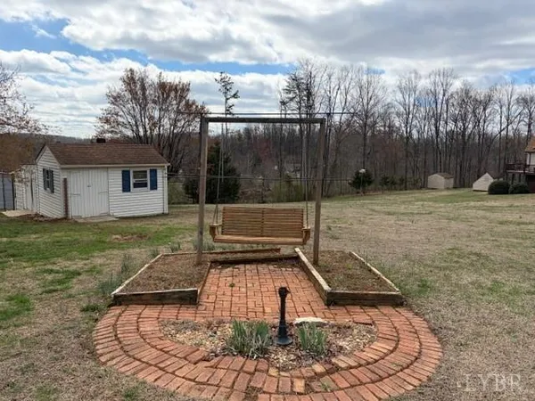 a view of a backyard with a small cabin