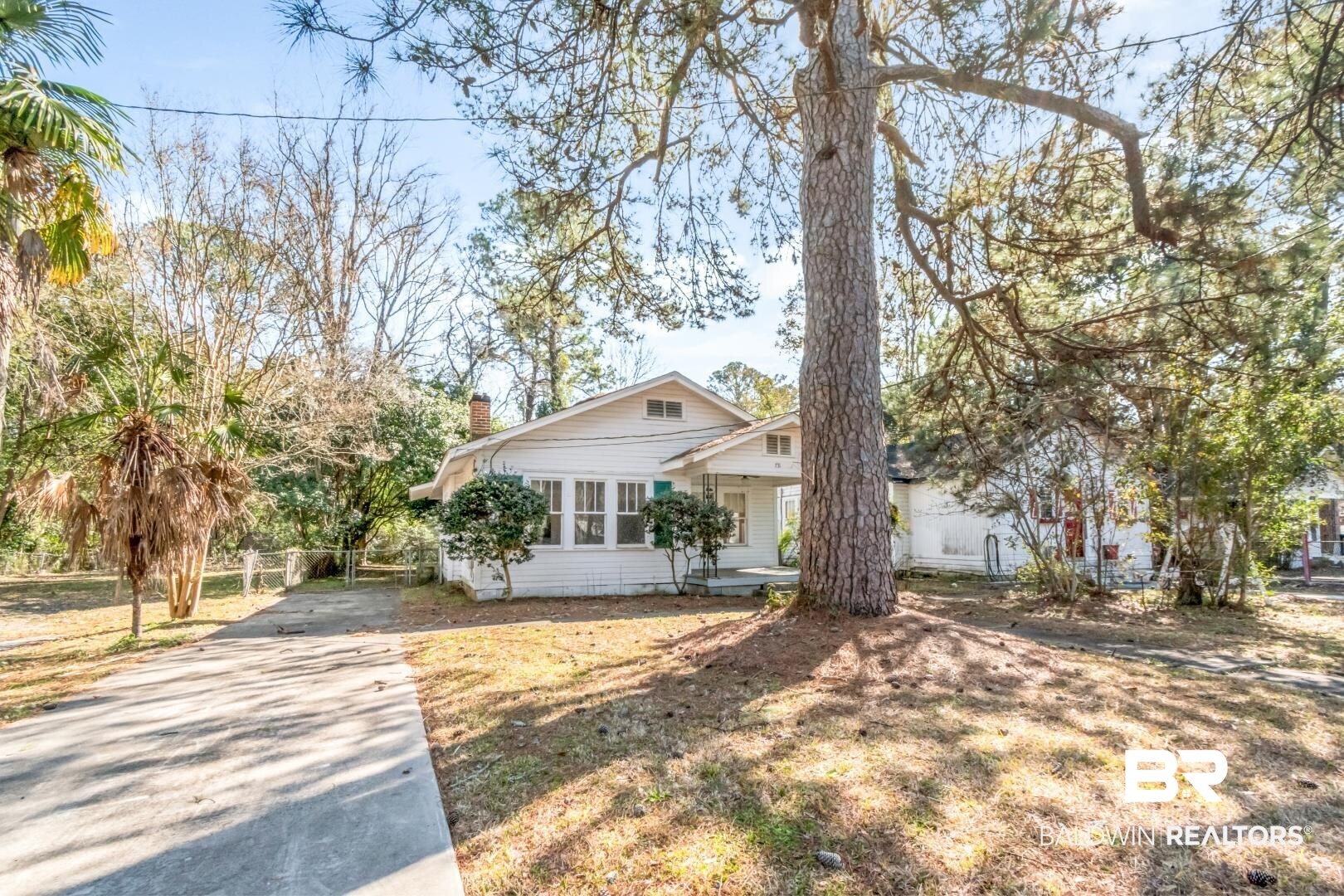 731 Jemison Street Mobile, AL 36606 - Photo 23 of 27 View of front of house with a chimney and driveway