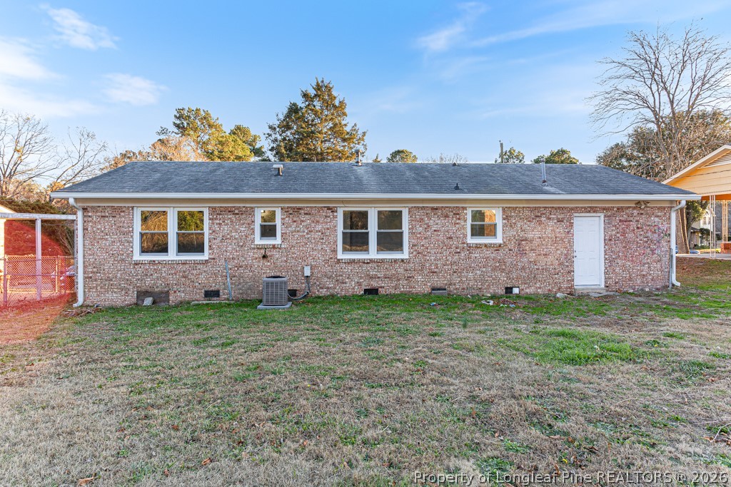922 Rancho Drive Fayetteville, NC 28303 - Photo 2 of 21 a view of a yard in front of a house with large trees