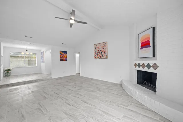 a view of a kitchen with microwave and stove top oven