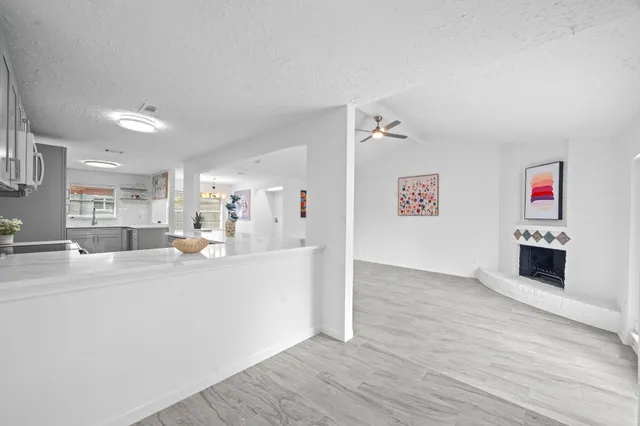 a view of kitchen with furniture and wooden floor