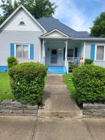 front view of a house and a yard
