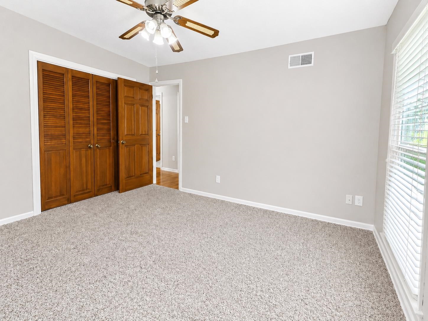 2148 Riverdale Road Germantown, TN 38138 - Photo 12 of 22 an empty room with windows and fan