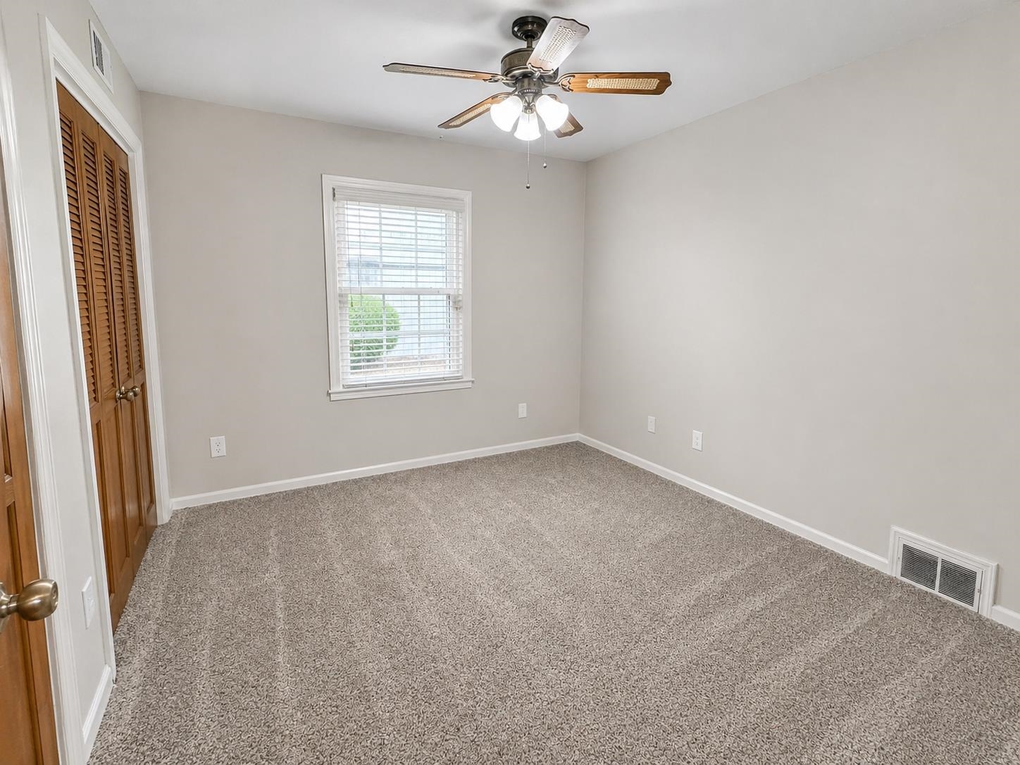 2148 Riverdale Road Germantown, TN 38138 - Photo 15 of 22 an empty room with windows and fan