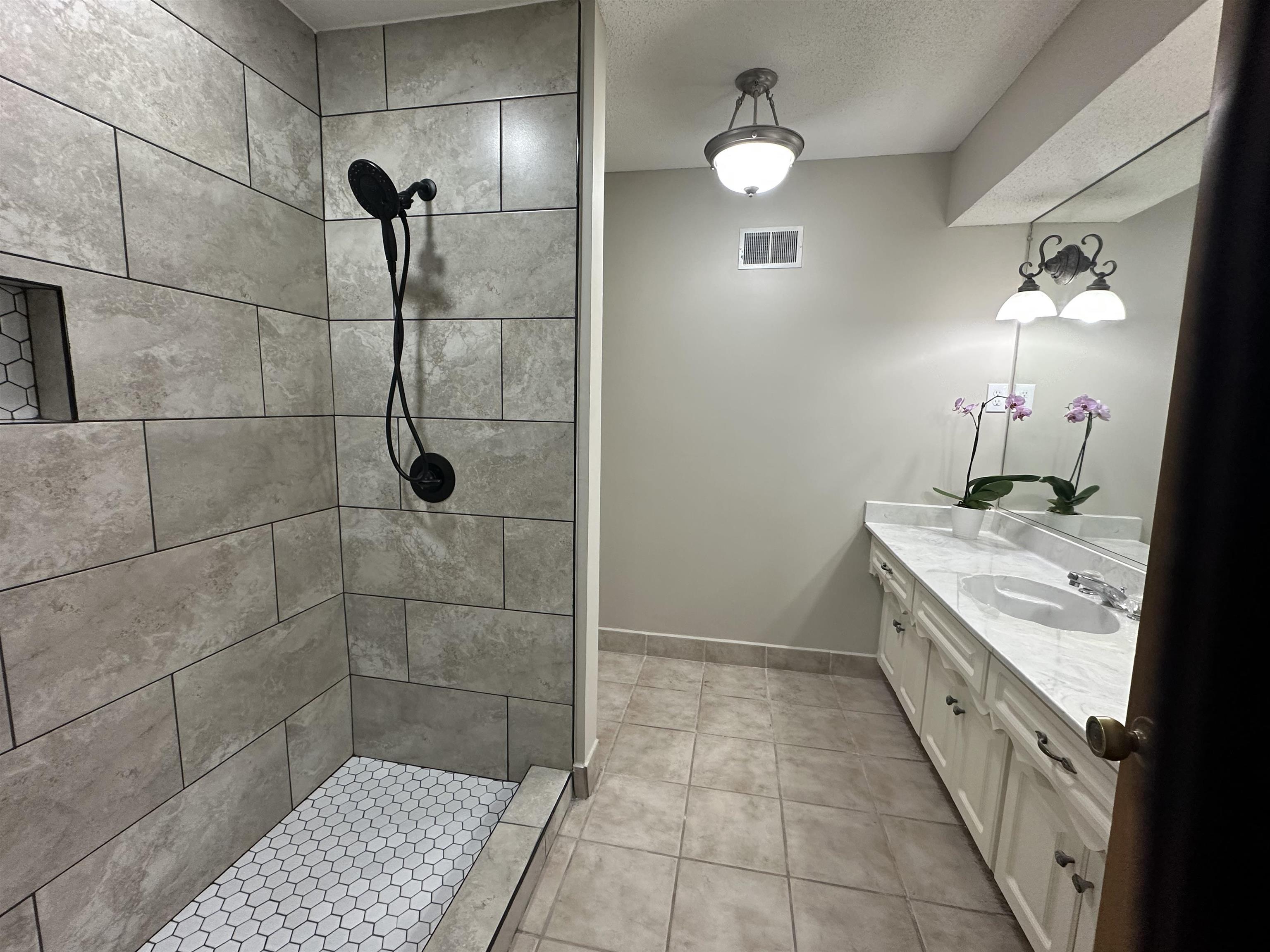 2148 Riverdale Road Germantown, TN 38138 - Photo 19 of 22 a bathroom with a double vanity sink a toilet and a shower