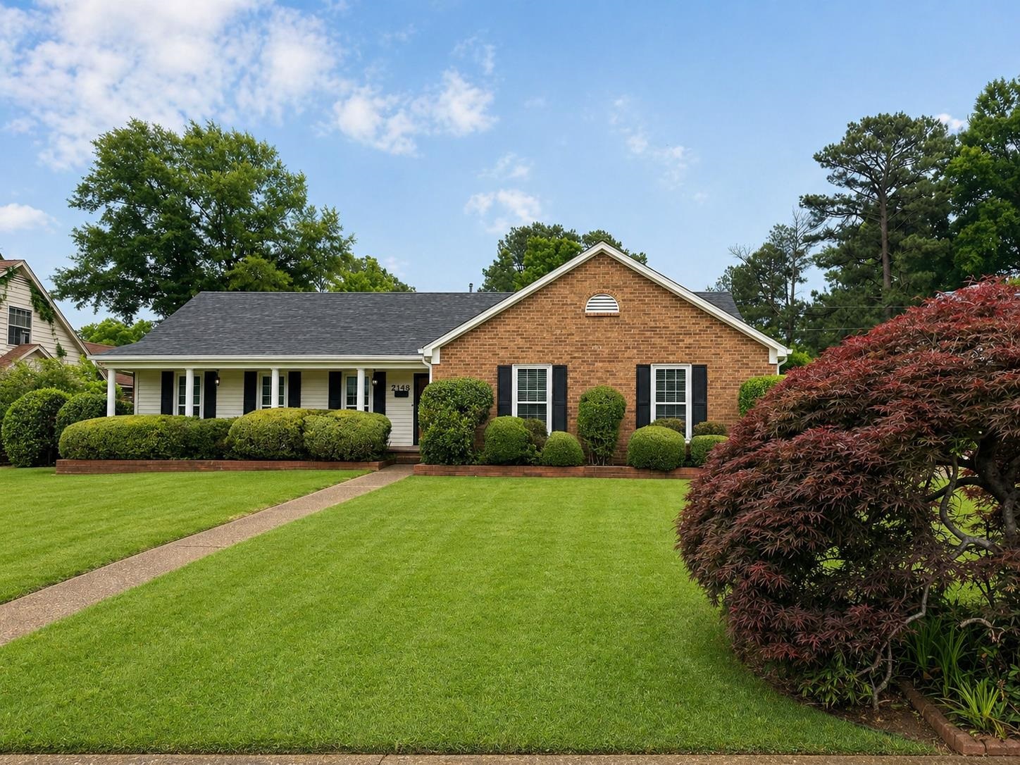 2148 Riverdale Road Germantown, TN 38138 - Photo 2 of 22 a front view of a house with a garden