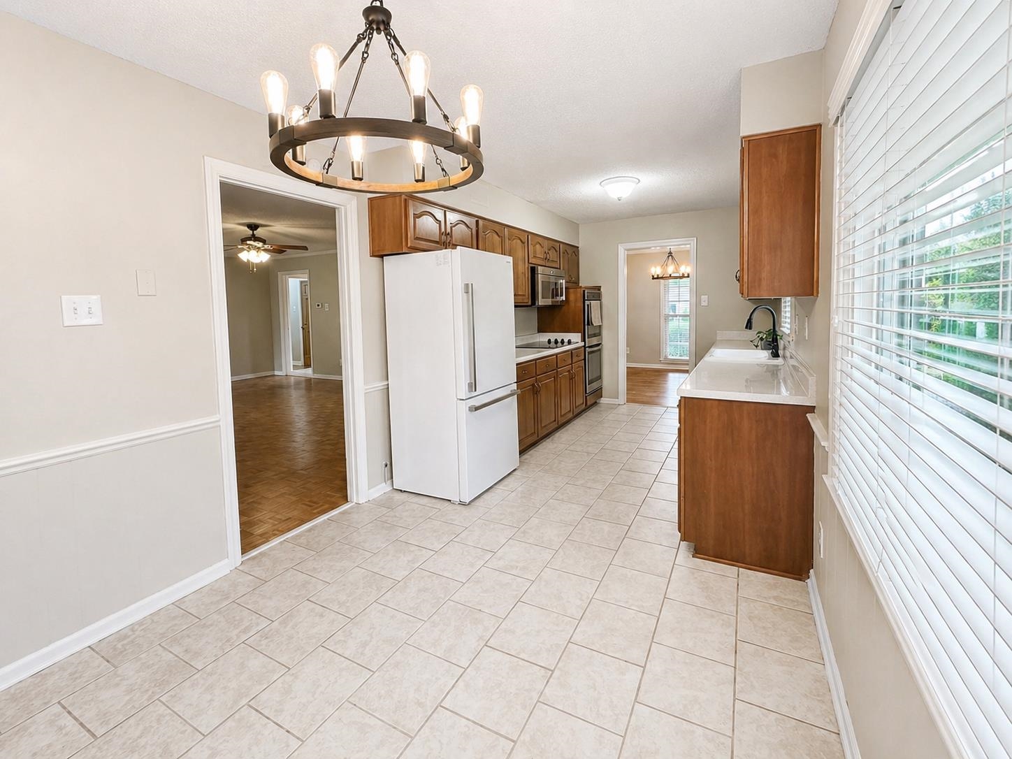2148 Riverdale Road Germantown, TN 38138 - Photo 8 of 22 a view of a kitchen with a refrigerator and a stove