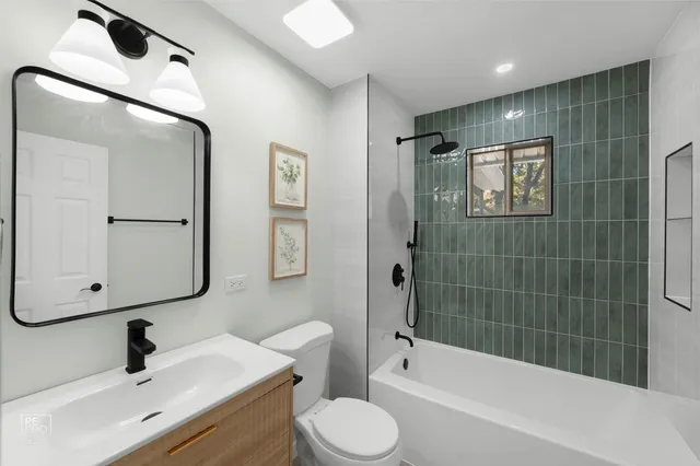 a bathroom with a toilet sink and shower
