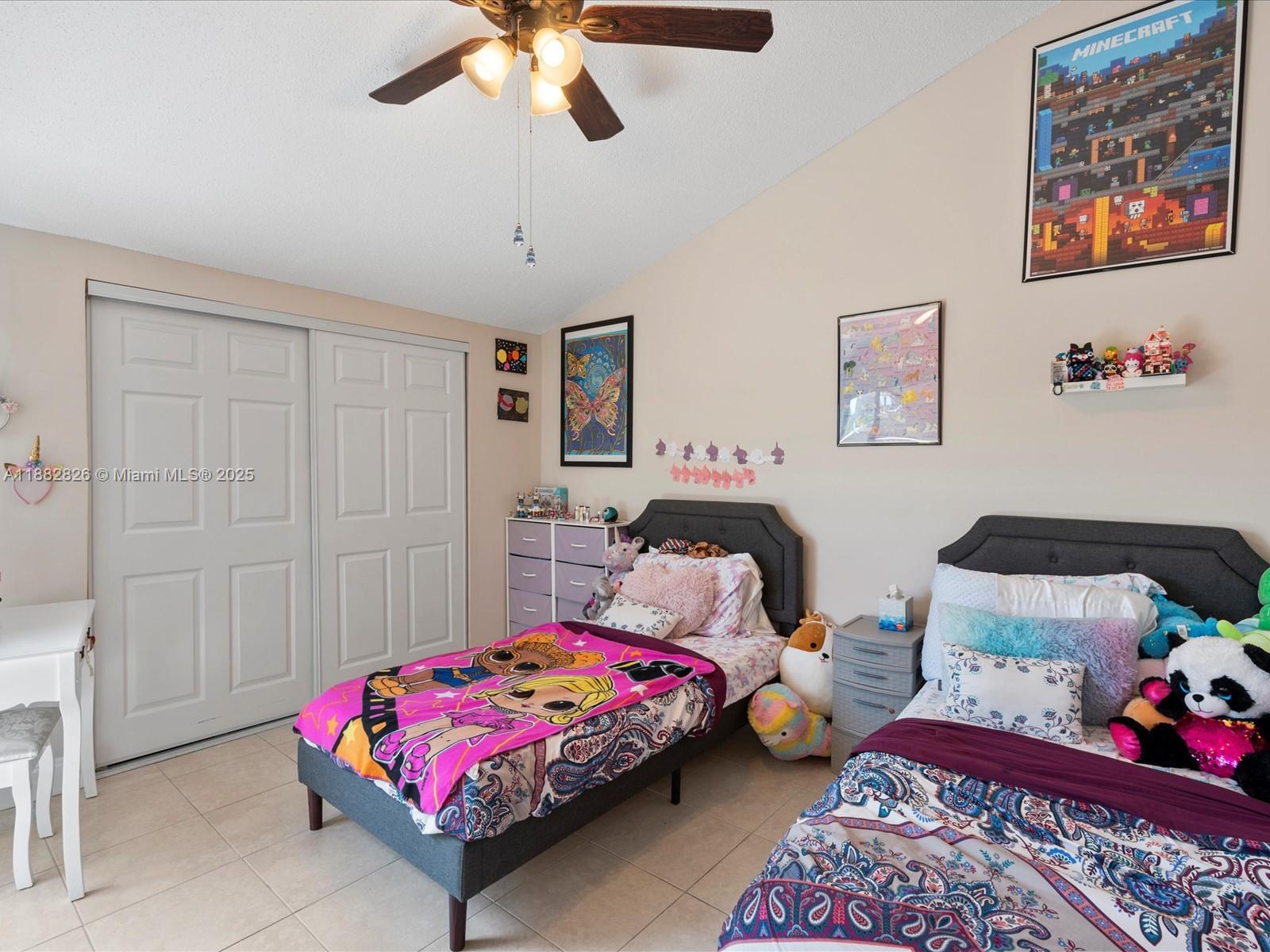 8401 West Sample Road, Unit 28 Coral Springs, FL 33065 - Photo 14 of 17 a bedroom with bed and window