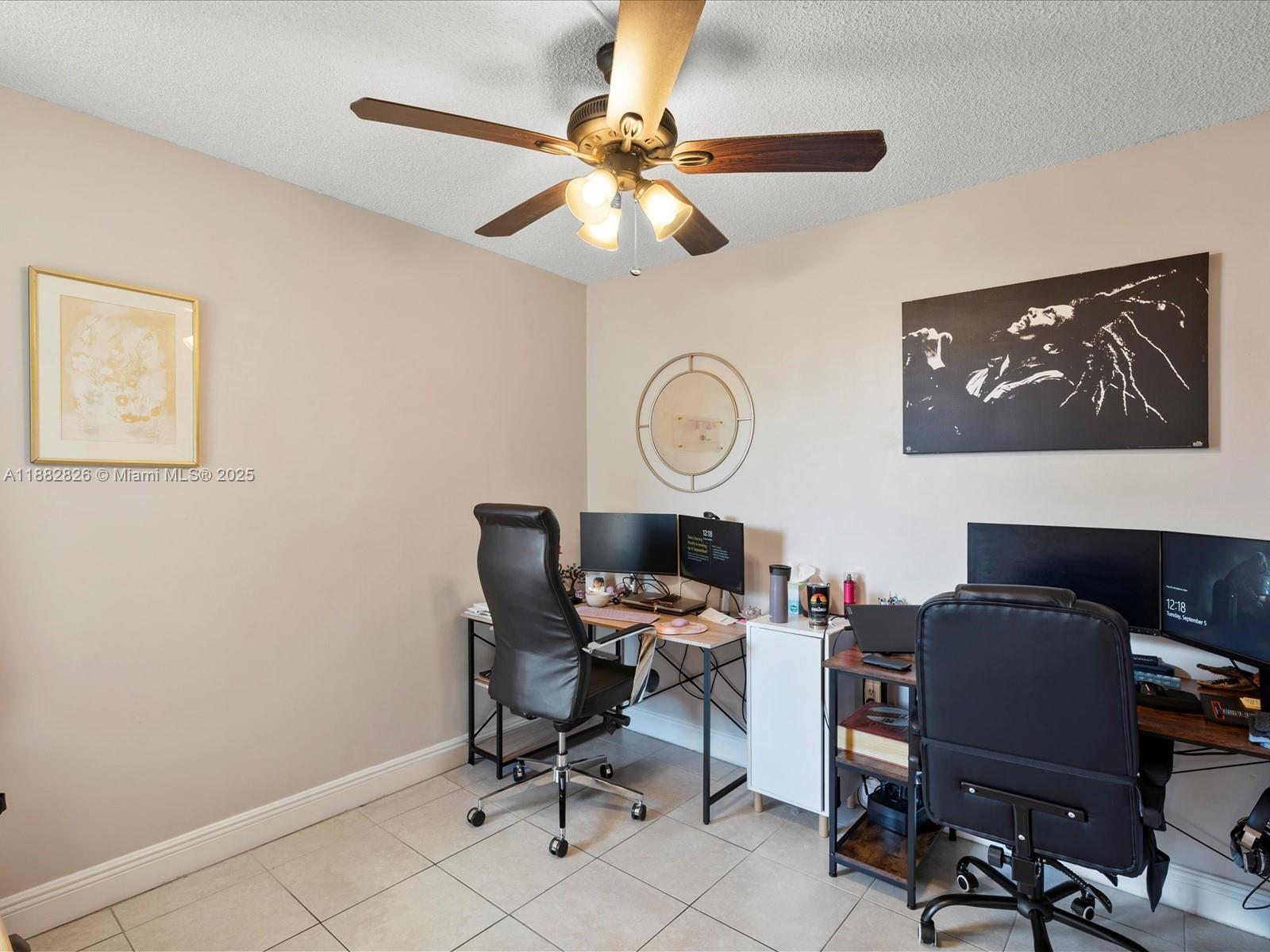 8401 West Sample Road, Unit 28 Coral Springs, FL 33065 - Photo 16 of 17 a view of a workspace with furniture