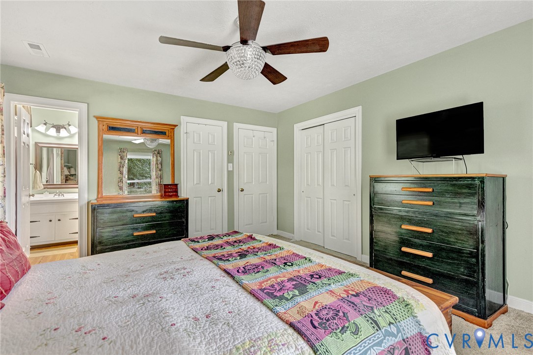 3841 Strawhill Road Richmond, VA 23231 - Photo 26 of 56 Spacious room featuring a ceiling fan with light f