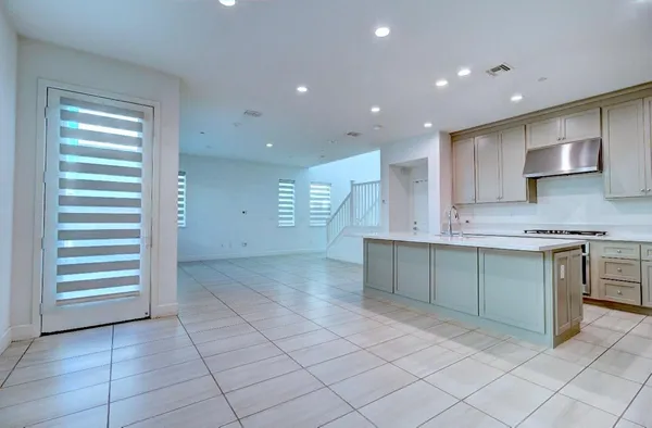 a kitchen with stainless steel appliances granite countertop a sink and cabinets