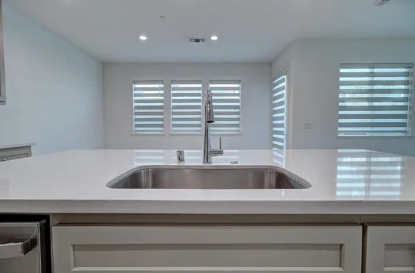 a view closed with a sink and wooden floor