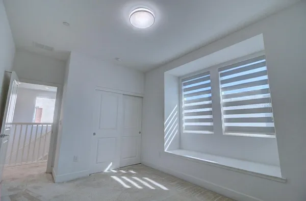 a view of empty room with stairs