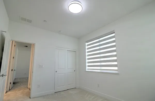 a view of a room that has a window in it