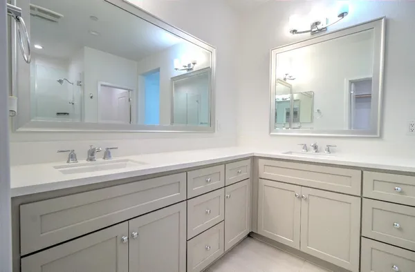 a bathroom with a sink and mirror