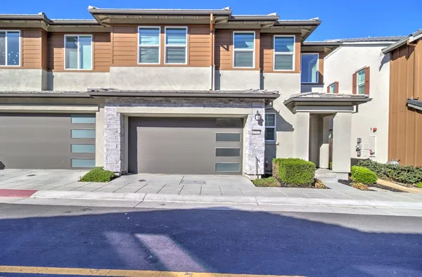 a front view of a house with yard