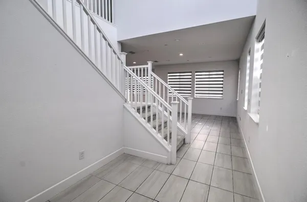 a view of entryway with stairs and a window