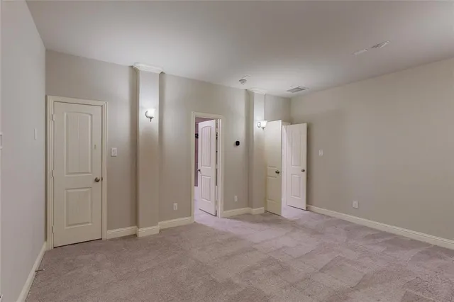 a bathroom with a granite countertop toilet sink and mirror