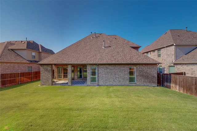 a view of a house with a yard and garage