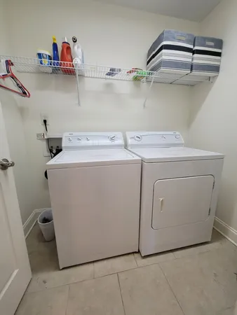 a utility room with dryer and washer
